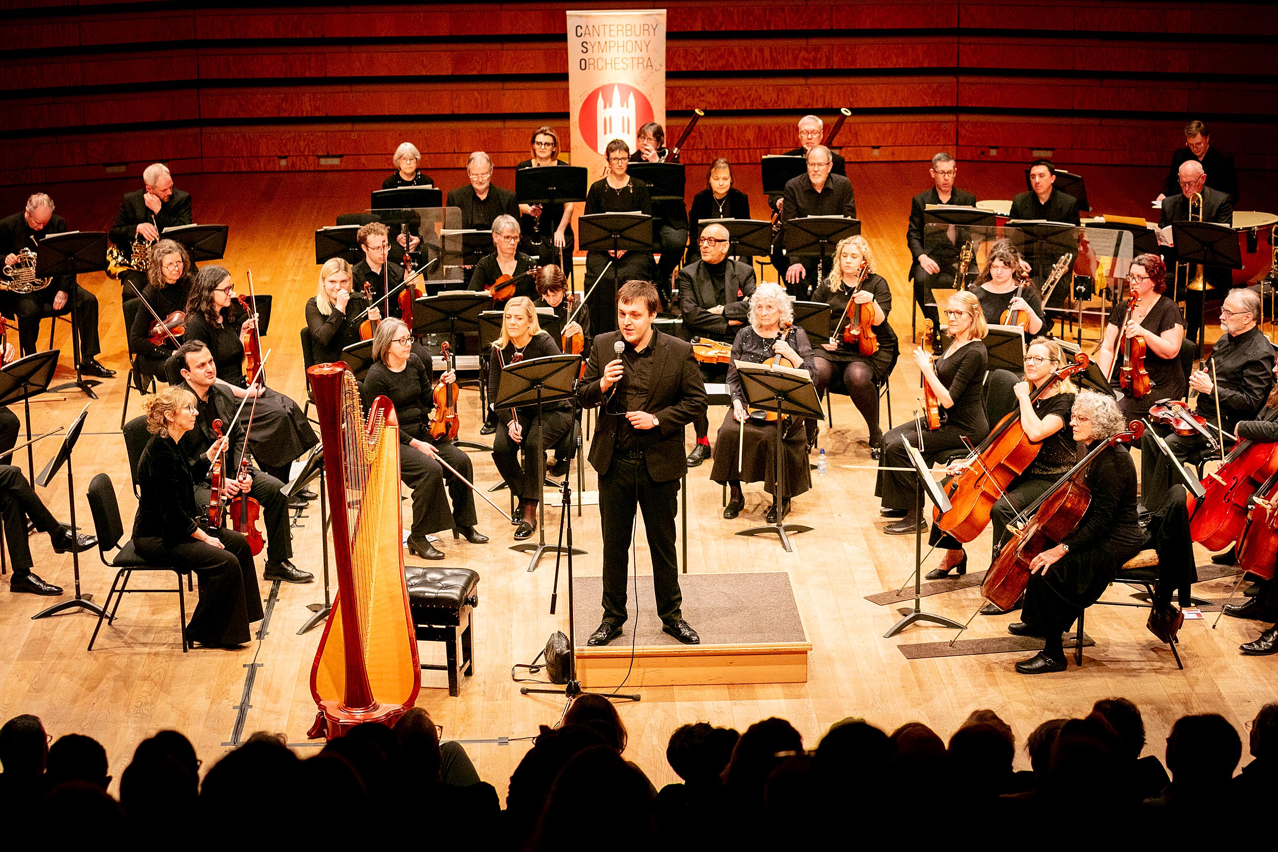 Andrew Lowen in discussion with soloist Katherine Tinker
